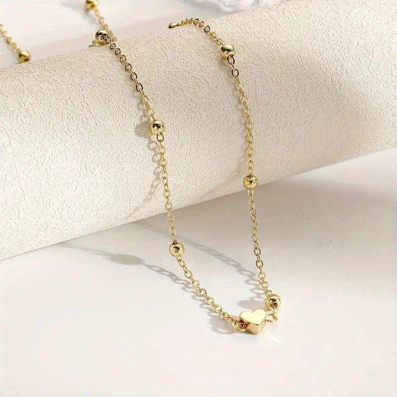 Sierlijke gouden hartvormige t - Body Jewelry Chain recensie en prijs